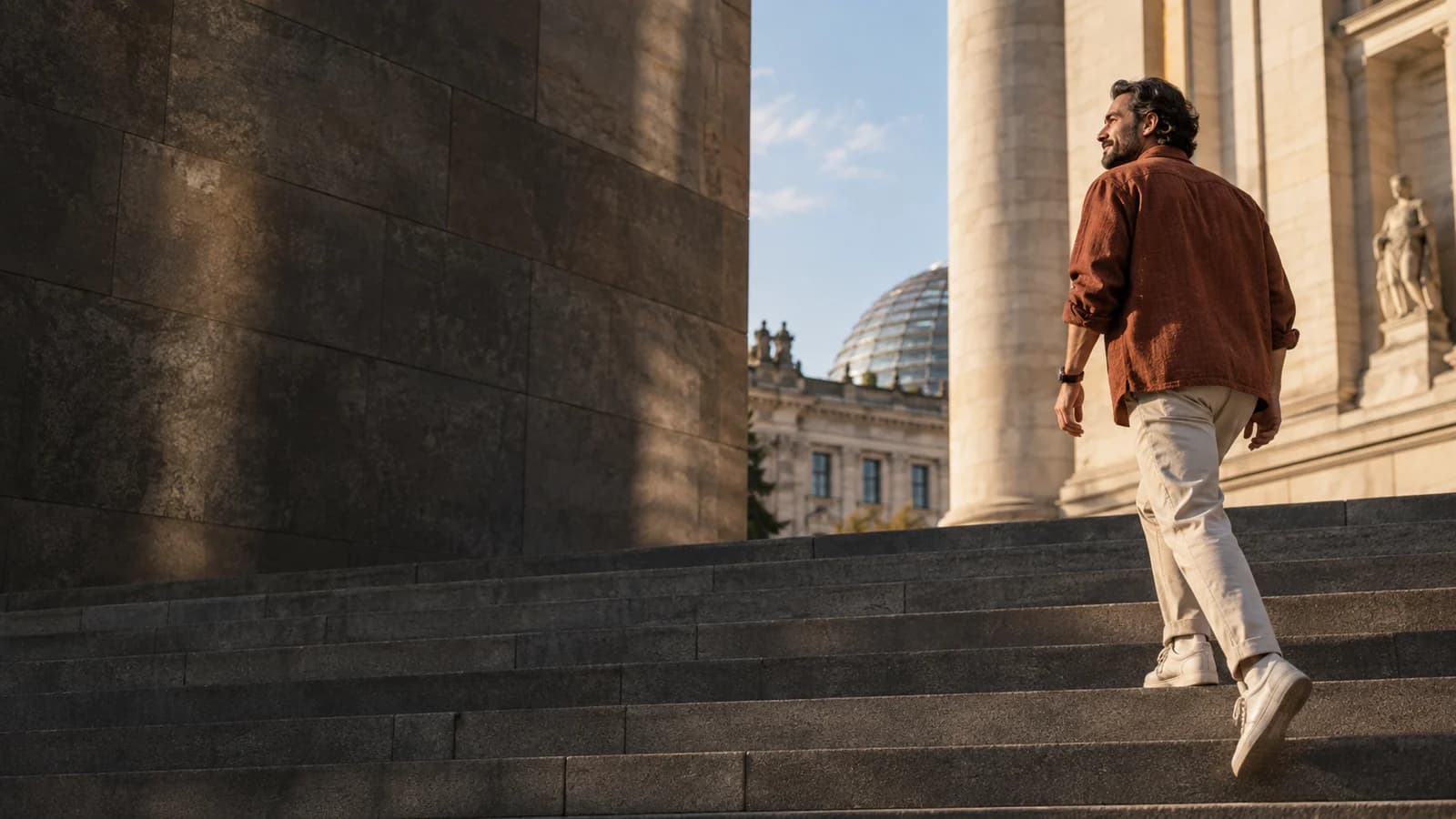 A professional taking the city steps in warm afternoon light